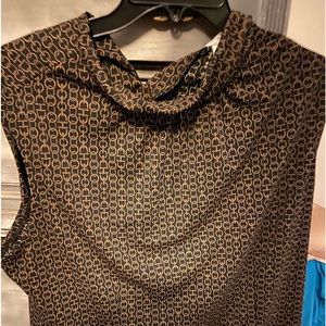 Black and gold patterned shirt with high neck .  Worn only once.